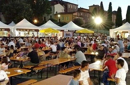 People enjoying the evening in Florence at the Baviera festival