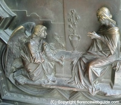 Angel Gabriel gives Mary a flower, relief on the cathedral door