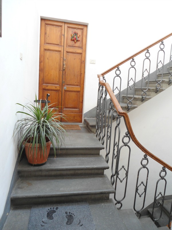 Antique style stairwell with wrought iron railing