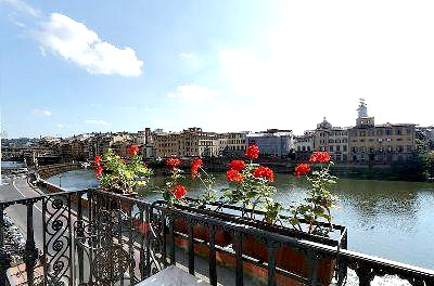 Wrought iron balcony looking out on the Arno from Hotel Bretagna