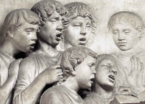 Close up of the faces of the singing youths on della Robbia's cantoria