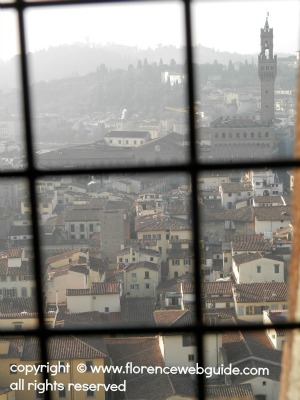 a view of Florence's Palazzo Vecchio from a window inside the Dome stairwell