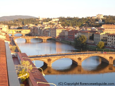 View of Arno and bridges at dusk from SESTO