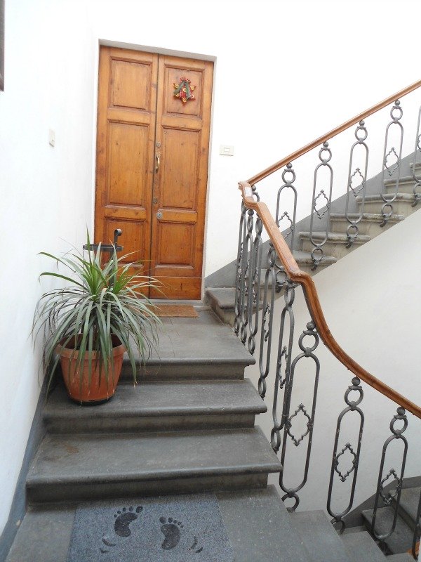 Antique style stairwell with wrought iron railing