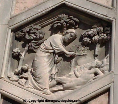 Bas-relief showing the Creation of Adam on first row of bell tower tiles
