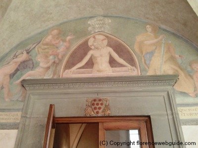 Fra Angelico fresco and Medici shield just above door