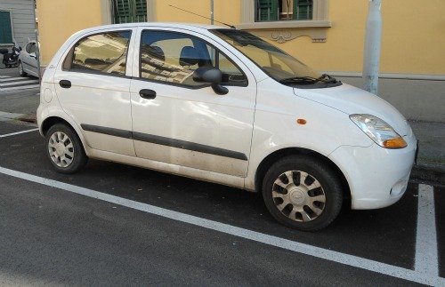 Car parked in white lines for residents only in Florence Italy