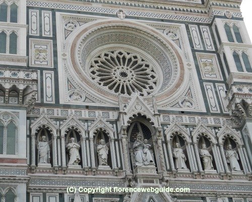 Cathedral front with statues of Mary in middle and apostles on sides