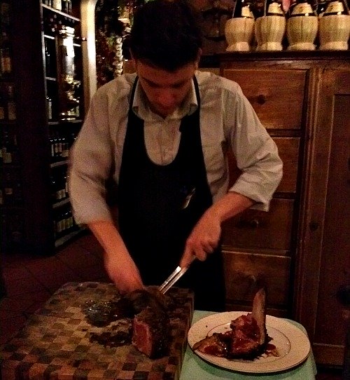 Steak being sliced on cutting board