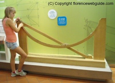 A young girl drops a ball to see the speed of movement using two different trajectories