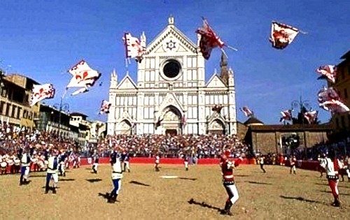 Florence flag throwers perform in front of Santa Croce before the historic football match in June