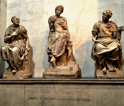Madonna and Child by Michelangelo flanked by two sculptures by his pupils
