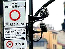 Traffic sign warning about the restricted driving zone with camera for catching drivers without authorization