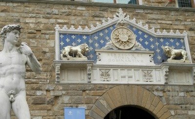 Main entrance to Palazzo Vecchio with symbols of Florence: David, lions and the giglio flower