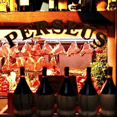 Look through the window at Perseus steaks hanging