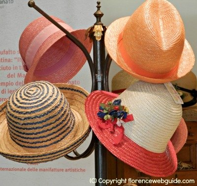 Colorful handmade hats at the Florence creativity fair